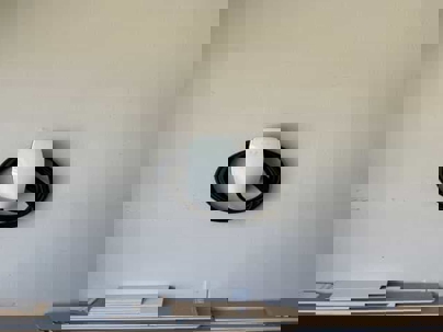 "Tesla Universal Wall Connector Magic Dock with integrated J1772 adapter and NACS compatibility"